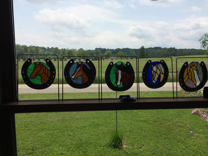 Custom horse shoe sun catchers using that horse's shoe.