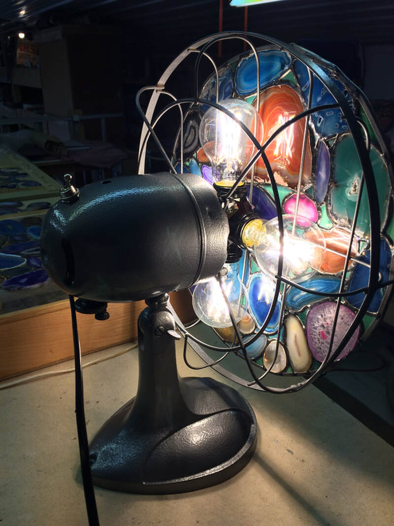 Agate rock slices in a removable disk in a fan lamp.