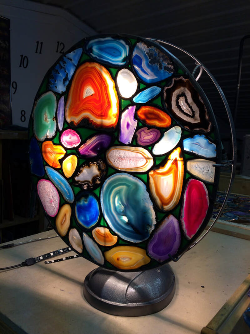 Agate rock slices in a removable disk in a fan lamp.
