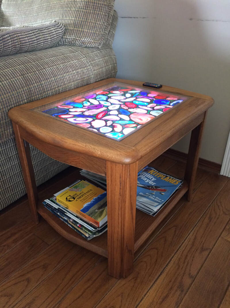 Coffee table top using agate rock slices with LEDs that change color.